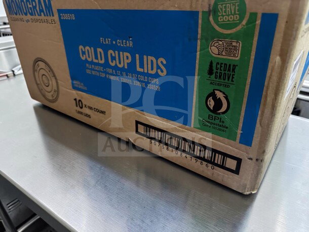 Monogram Serve Good compostable PLA cold cup lids, 1,000-count, pristine condition, fit 9-20 oz cups, straw slot.