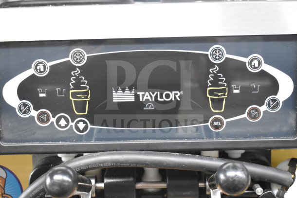 Taylor C723-33 soft serve machine control panel with brand logo and operation buttons.