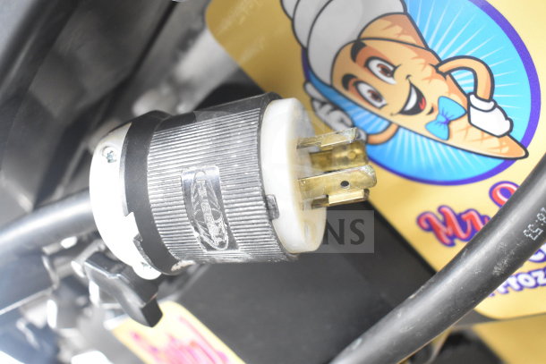 Taylor C723-33 ice cream machine plug detail; Hubbell label on connector, Mr. J's Frozen graphic in background.