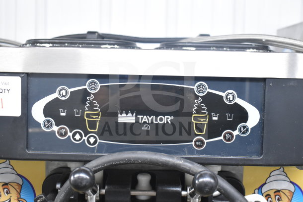 Taylor C723-33 soft serve machine panel with controls and brand logo, showcasing features and settings.