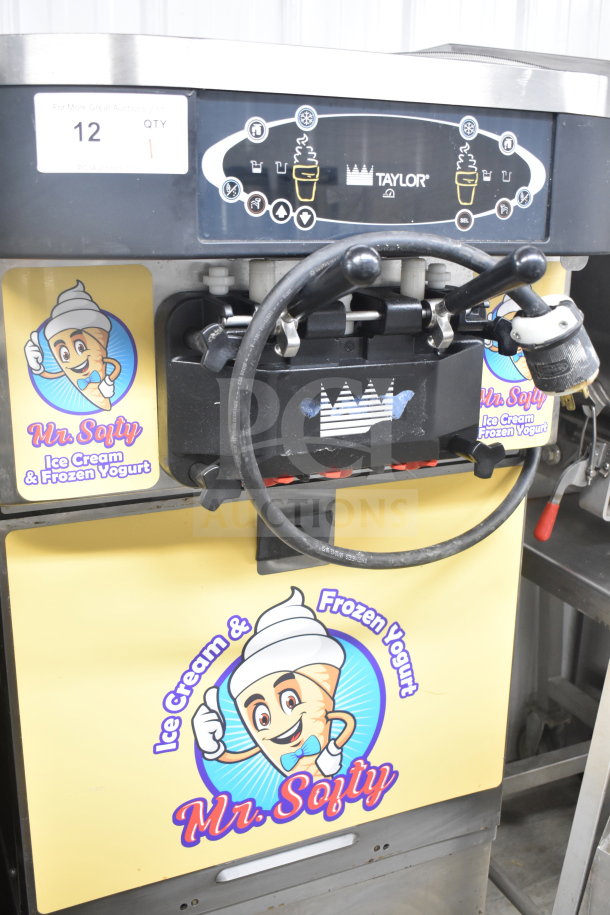 Taylor C723-33 commercial floor-style water-cooled soft serve machine, 2 flavors with twist, on casters, 208-230 volts, 3 phase.