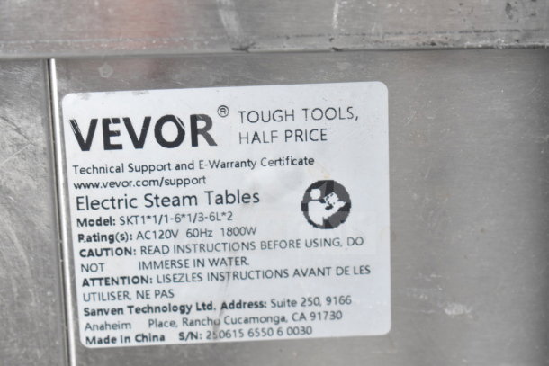 Vevor SKT1 electric steam table label indicating 120V, 60Hz, 1800W. Instructions caution against water immersion.