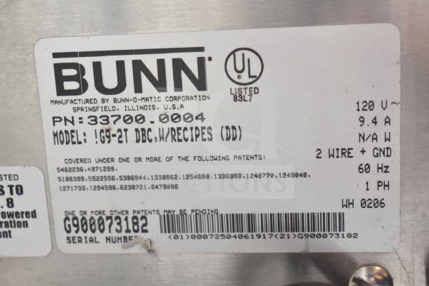 Bunn G9-2T countertop coffee grinder label, 120 volts, 1 phase, UL listed, serial number G900073182, with patent details.