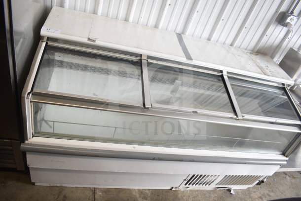 Hussmann LBN-6 ice cream freezer merchandiser, commercial grade, glass sliding top, visible wear, 115V, 1-phase.