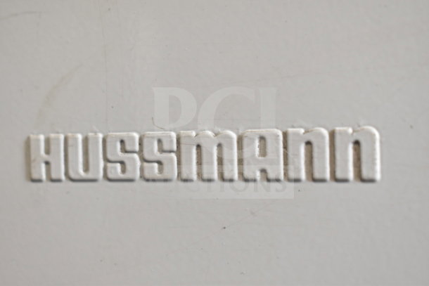 Close-up of "Hussmann" logo on Hussmann LBN-6 Commercial Novelty Ice Cream Freezer Merchandiser, 115 volts, 1 phase.