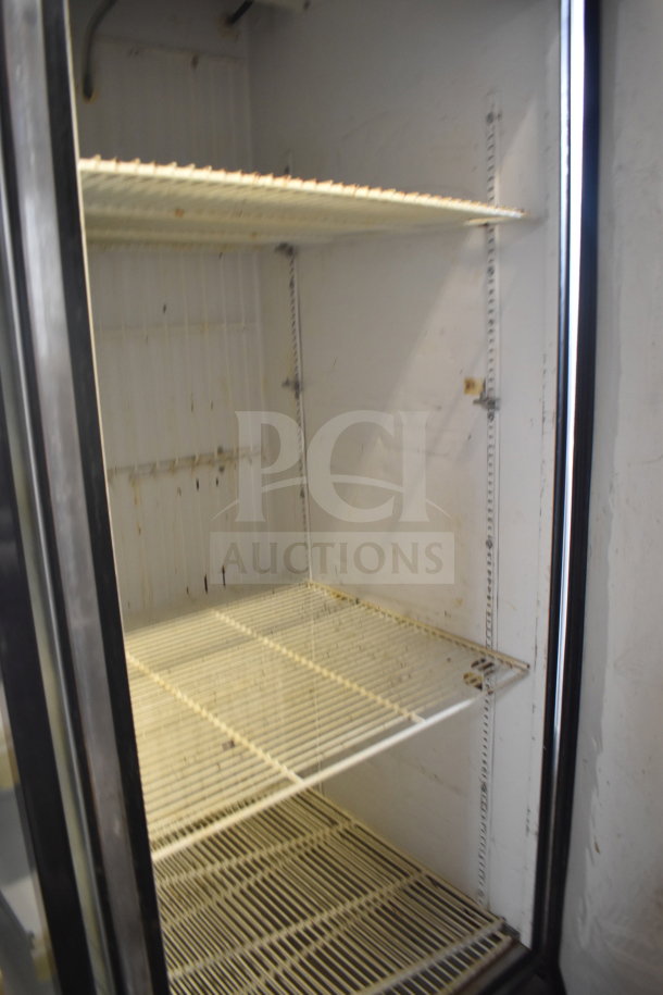 True T-23F commercial reach-in freezer, single door, on casters. Interior shelving visible. 115 Volts, 1 Phase.
