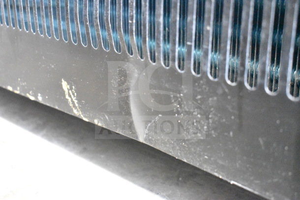 Sanye Commercial Open Grab N Go Merchandiser, black panel with visible scuffs and scratches, vents partially shown.