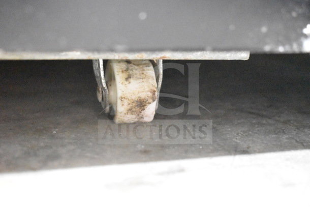 Cooler Depot 2-door reach-in cooler on commercial casters, visible damage includes broken glass.