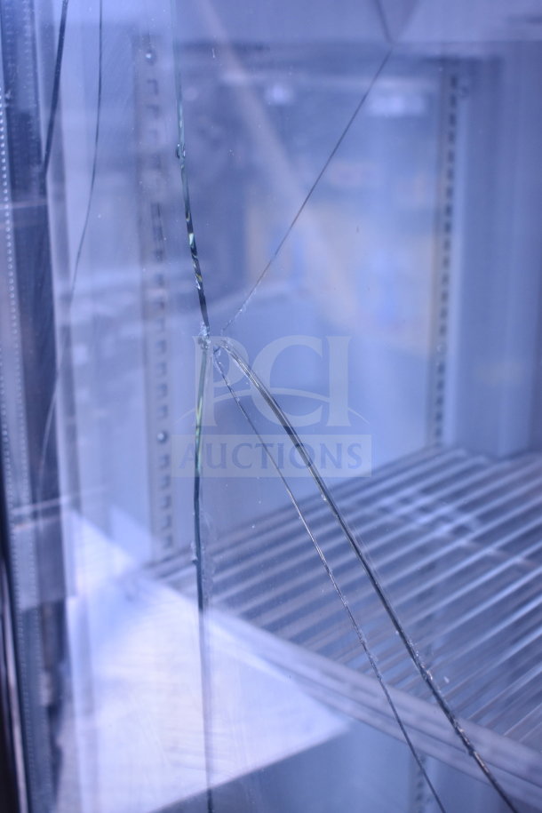 Cooler Depot 2 Door Cooler; broken glass highlighted. Commercial casters included. Ideal for repair or parts.