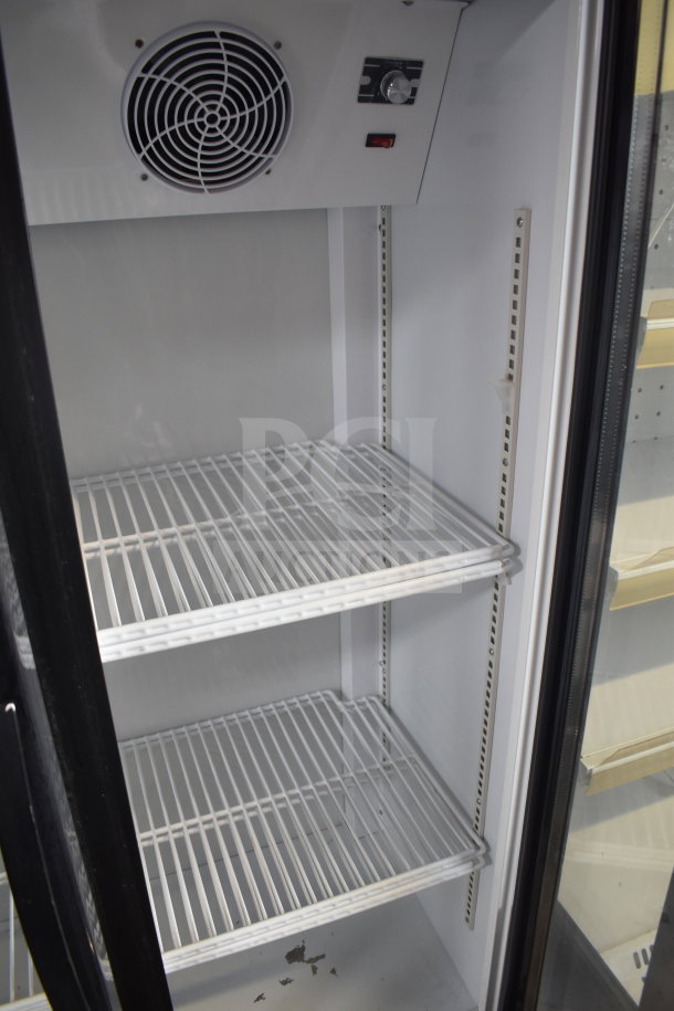 Cooler Depot commercial reach-in cooler, two-door with shelves, on casters. Note: broken glass indicated in description.