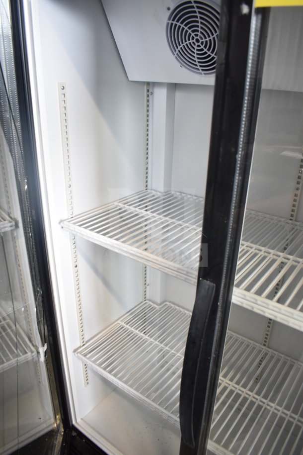Cooler Depot 2 Door Reach In Cooler, commercial casters, visible broken glass detail, interior shelving, fan unit.