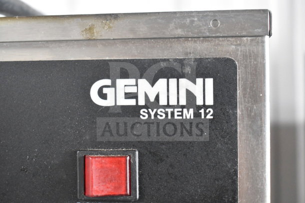 Curtis GEM-12-10 commercial coffee machine, Gemini System 12 label shown with red power switch, stainless steel exterior.