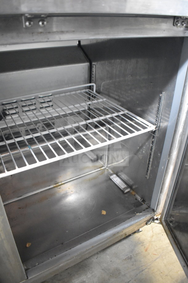 Saba SUC-48R commercial two-door undercounter cooler, stainless steel interior, adjustable shelving, 115 volts, used condition.