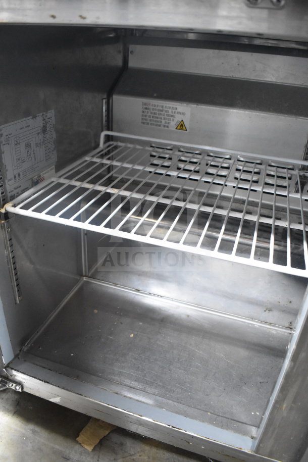 Saba SUC-48R commercial undercounter cooler; two-door, stainless interior, adjustable shelf, 115V, 1 phase, model tag visible.
