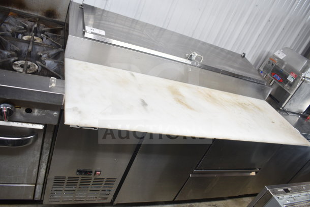 Avantco commercial pizza prep table with 2 drawers, 1 door, on casters. Features stainless steel, 115V, 1 phase. Used condition.