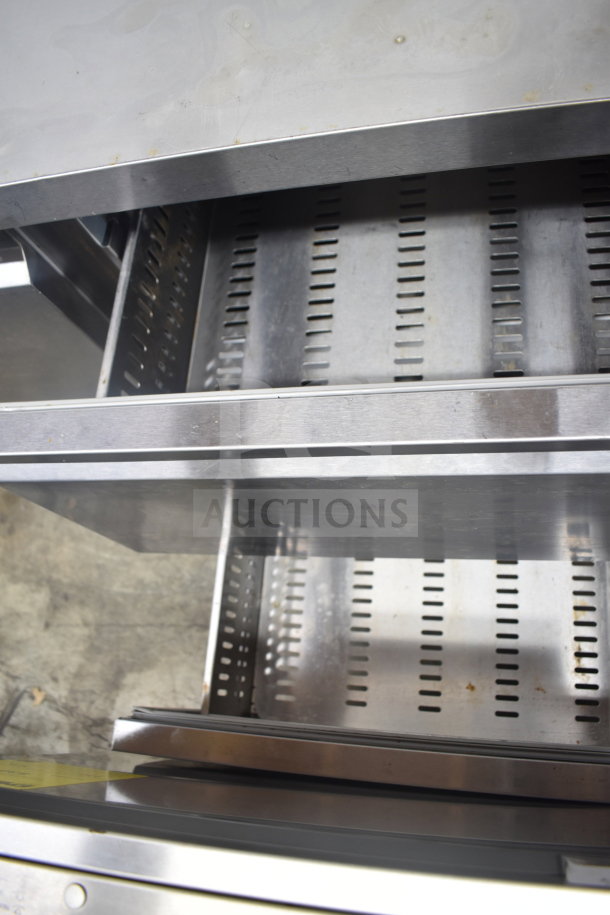 Avantco Commercial Pizza Prep Table with 2 drawers and 1 door, stainless steel, on casters, 115V, 1 Phase.