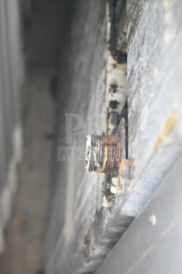Corroded metal component on Southbend gas-powered range, indicating signs of wear and need for maintenance.