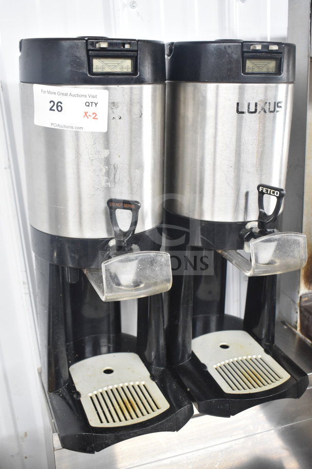 Two Fetco Luxus L3D-10 beverage dispensers, stainless steel, used condition, visible tag indicating quantity "X-2".