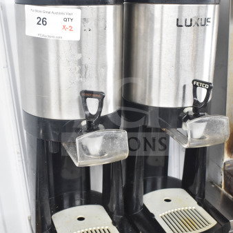 Two Fetco Luxus L3D-10 beverage dispensers, stainless steel, used condition, visible tag indicating quantity "X-2".