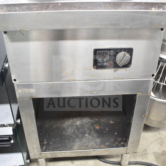 T&P PSL-80-RA2 single burner induction wok range in used condition, with digital controls and stainless steel body.