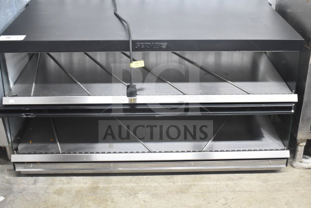 ServIt 2 Tier Warming Display, Commercial Countertop, 115/208V, 1 Phase. Stainless steel, minor wear on shelves.