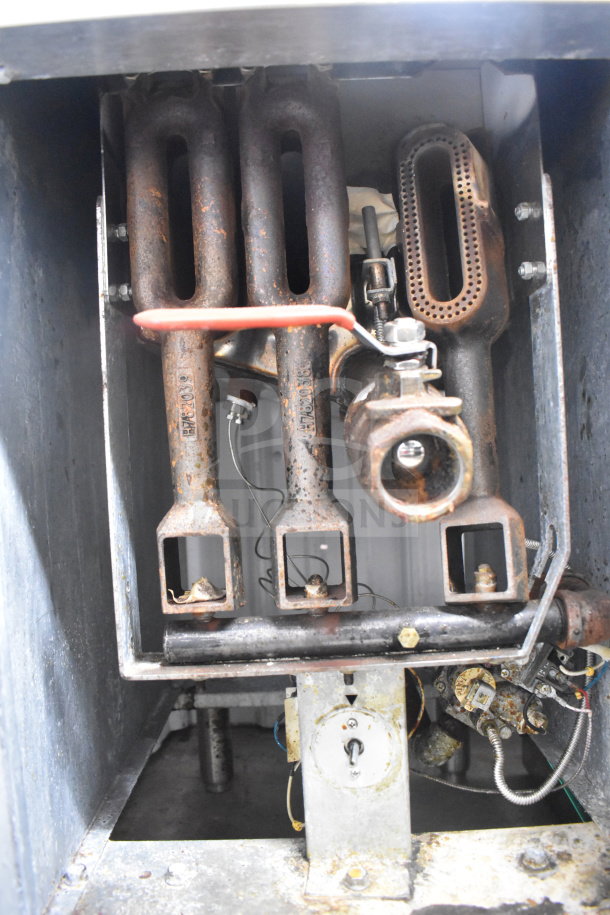 Entree F3-N commercial deep fat fryer interior, showing gas burner assembly, pipes, and components. 90,000 BTU, used.