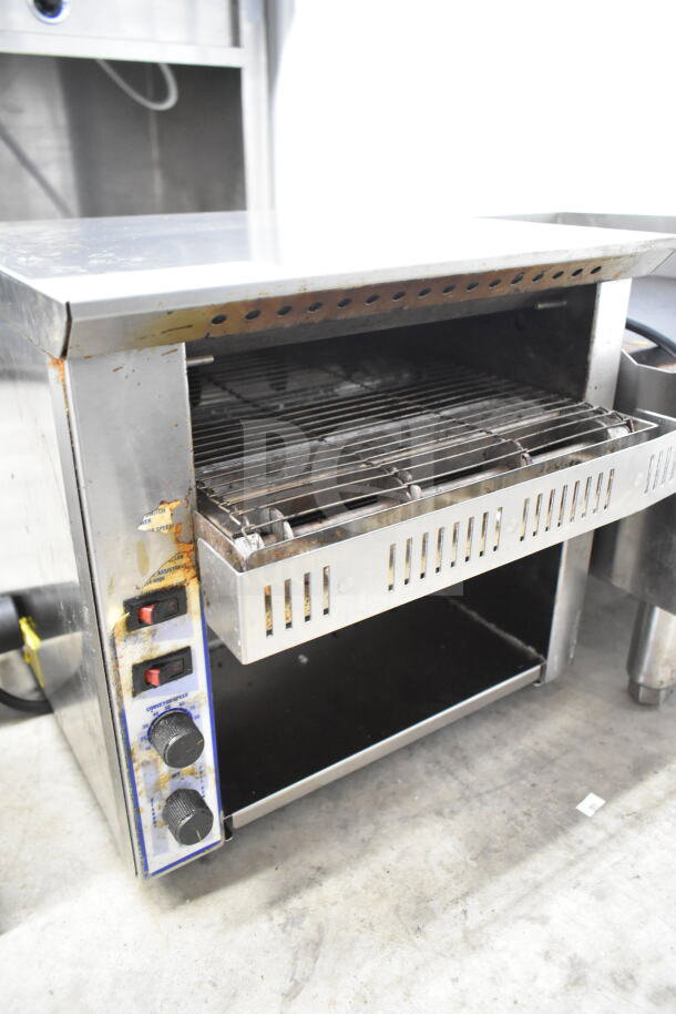 Belleco JT1-H commercial electric conveyor toaster oven, 120V, with visible dials and signs of wear.