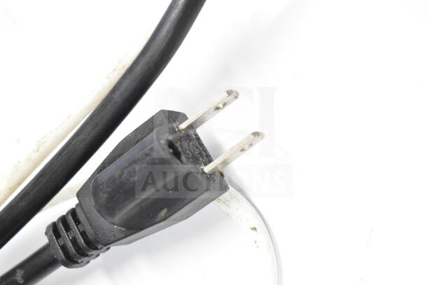 Close-up of a standard black two-prong power plug attached to the Sdzt SDZ-45 Ice Machine cord.