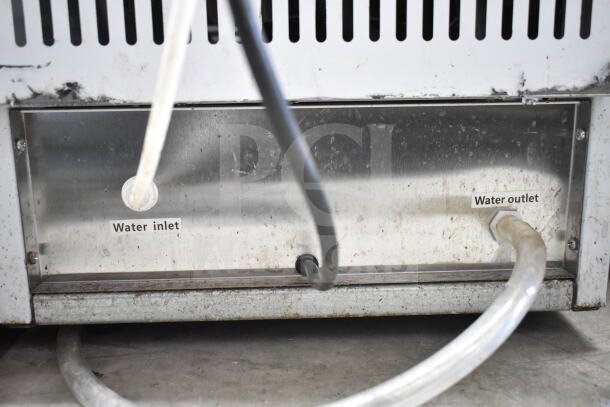 Sdzt SDZ-45 ice machine showing water inlet and outlet connections, undercounter design, used condition.
