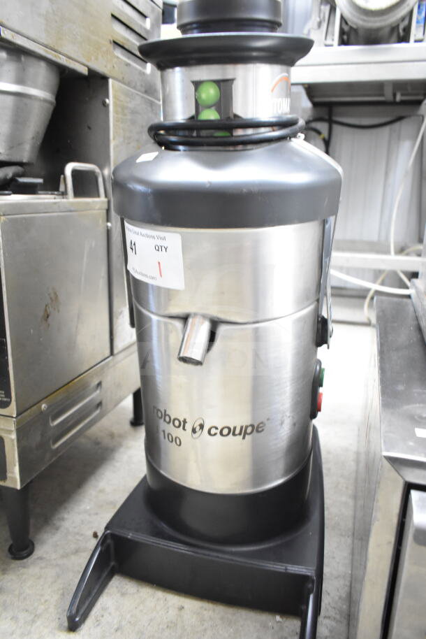 Robot Coupe J100 Commercial Juicer, stainless steel, 115V, 1 Phase. Features power switch and spout. Auction tag visible.
