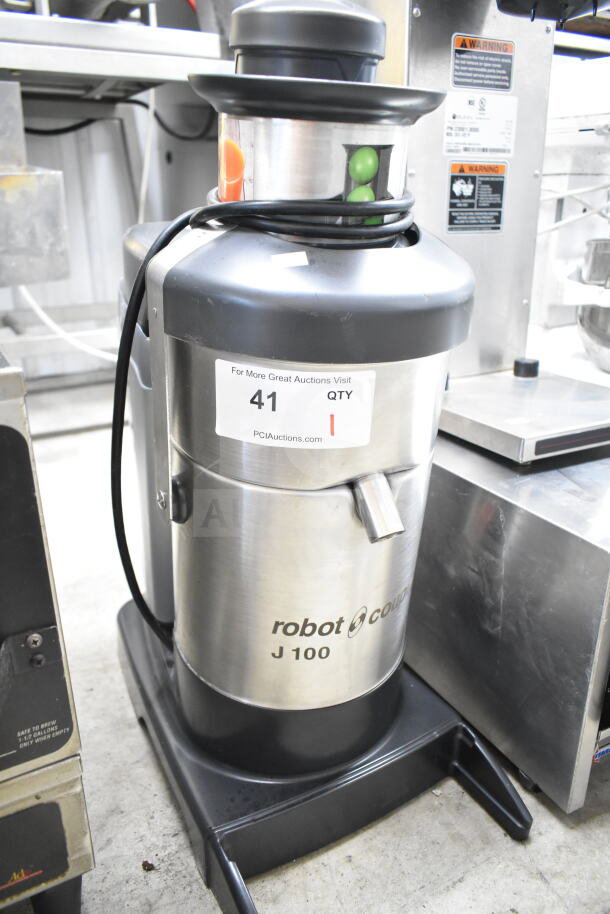 Robot Coupe J100 commercial juicer, stainless steel, 115 volts, 1 phase, excellent condition, auction label on front.