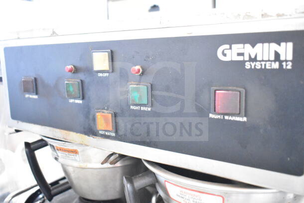 Curtis GEM-12-10 coffee machine control panel; features brew and warmer buttons; commercial use; visible wear.