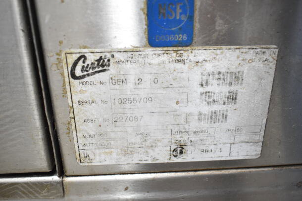 Curtis GEM-12-10 coffee machine label, showing model, serial number 10255709, and voltage specifications.