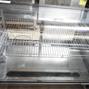 Omcan 27157 countertop refrigerated display case, model 27157, with two shelves, 110 volts, 1 phase, in near-new condition.