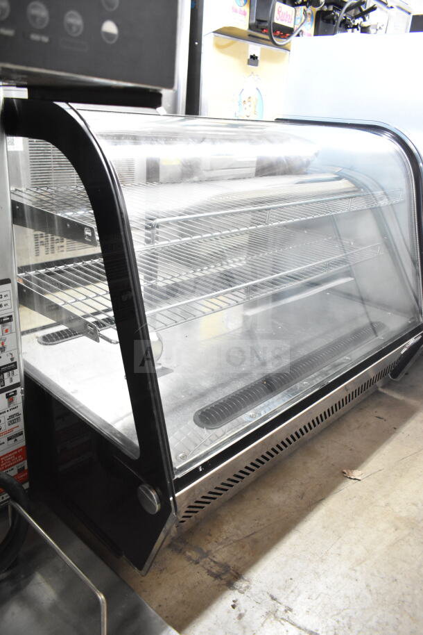 Omcan 27157 countertop refrigerated display case merchandiser, 110V, 1 phase, clear curved glass front, metal shelves.