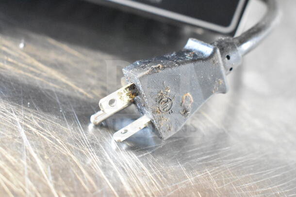 Plug of the FY-119 Countertop 6 Stick Waffle Maker, 110 Volts, 1 Phase, showing wear.