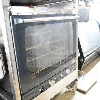 2021 Cadco XAFT133 Arianna countertop convection oven on casters, 208-240V, stainless steel, visible control panel.