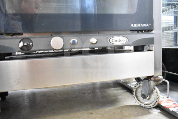 2021 Cadco XAFT133 Arianna countertop convection oven on commercial casters, 208-240 volts, visible brand label.