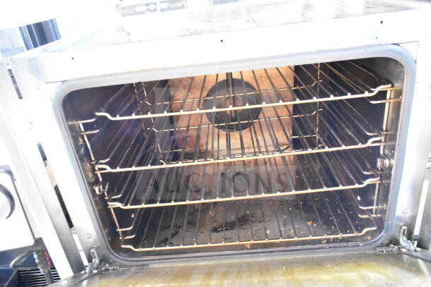 2021 Cadco XAFT133 half-size convection oven, stainless steel, multiple racks, on commercial casters, 208-240V.