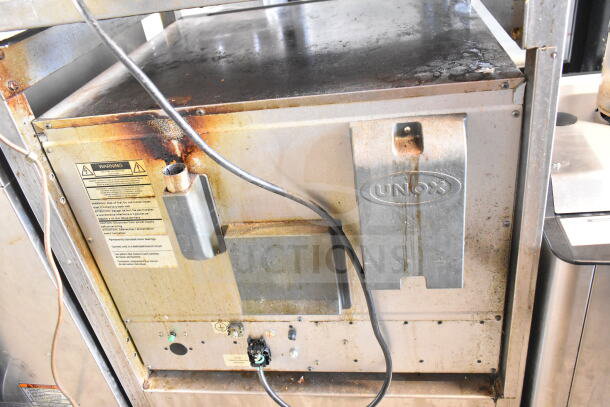 2021 Cadco XAFT133 Arianna convection oven on casters. Visible wear and usage marks, warning labels intact.