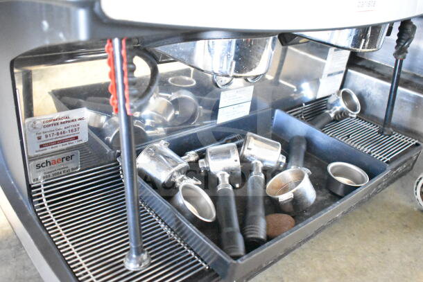 Schaerer Barista 2 Group Espresso Machine, includes 2 hoppers, 4 portafilters, 2 steam wands. Visible service label.