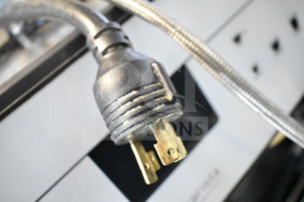 Schaerer Barista 2 Group Espresso Machine plug and fittings, showing robust construction and industrial design.