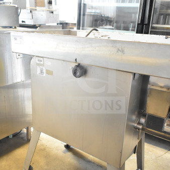 Sirman TC 32 MONTANA E commercial meat grinder, electric, 220V, 3-phase, stainless steel, on wheels. Minor wear visible.