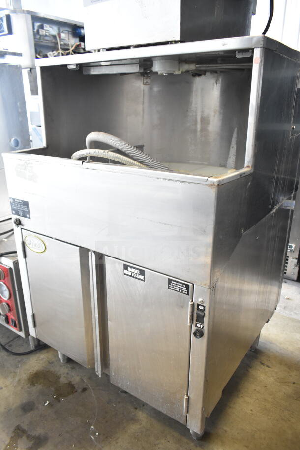 CMA GL-C Commercial Undercounter Glass Washer, 208/240V, 1 Phase, stainless steel, used condition. Visible high voltage warning.