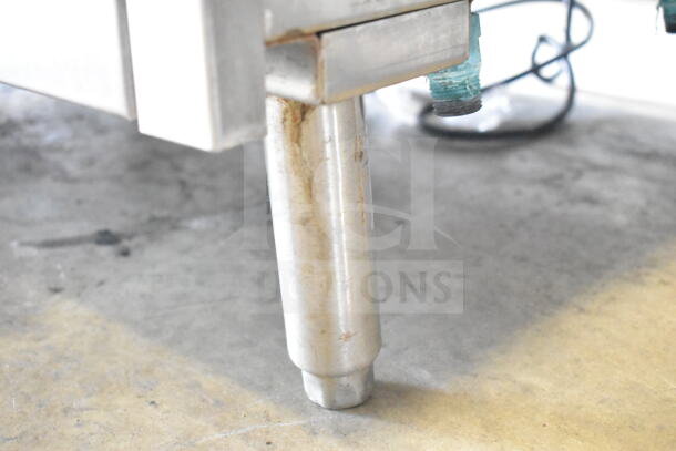 CMA GL-C undercounter glass washer leg, stainless steel, shows signs of use. Suitable for 208/240 Volts, 1 Phase.