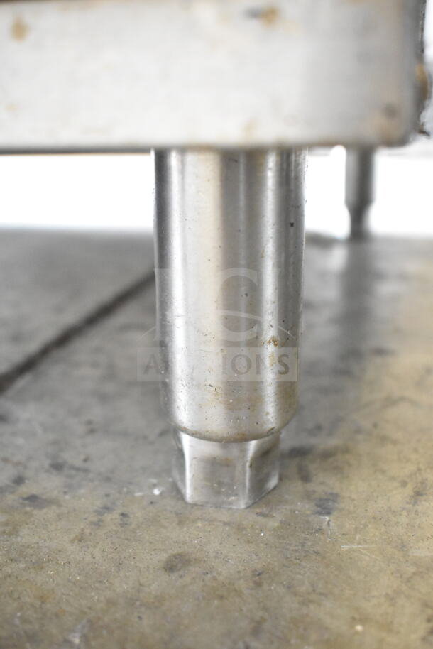 Close-up of Avantco 177DPO18S pizza oven leg, showcasing the stainless steel material and sturdy construction.