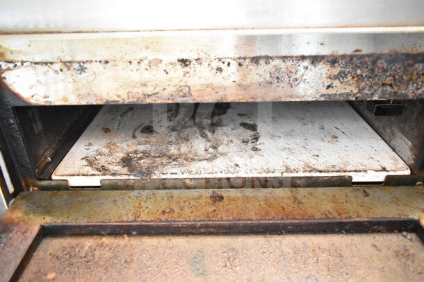 Avantco 177DPO18S countertop pizza oven with cooking stone, electric, single deck, visible signs of use and wear.