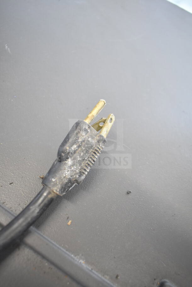 A power plug, slightly worn and dusty, suitable for a Manitowoc RNS12AT-161 countertop ice maker and water dispenser.