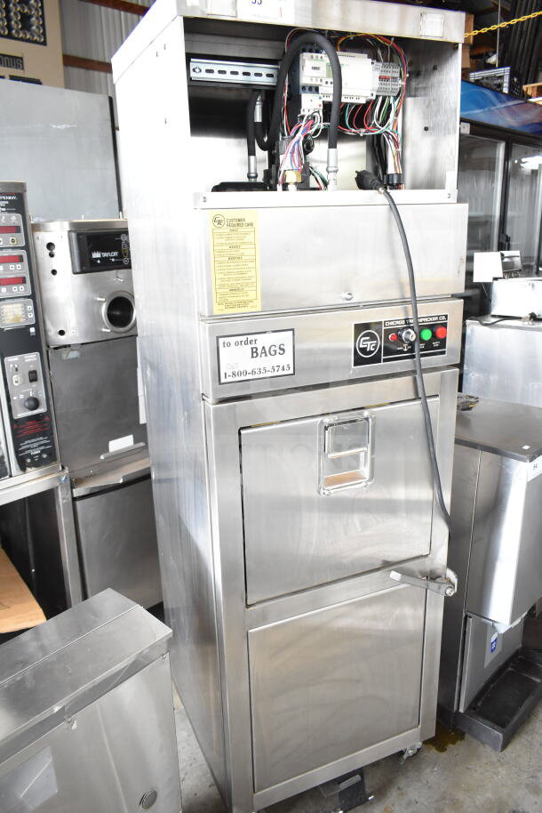 Chicago Commercial Vertical Style Compactor on casters with control panel, wiring, and labels for orders. Stainless steel finish.