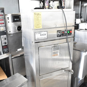 Chicago Commercial Vertical Style Compactor on casters with control panel, wiring, and labels for orders. Stainless steel finish.